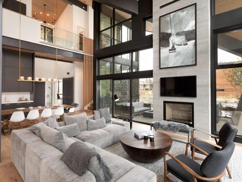 Interior photo of the Whistler Escape home, with fireplace, floor to ceiling windows.